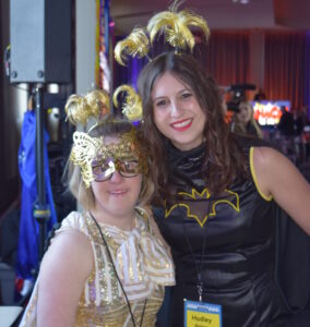 Two women dressed up for a costume party.